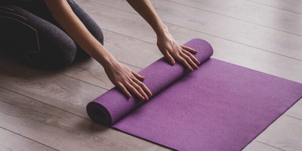 Rolled yoga mat and a calm corner for gentle mobility